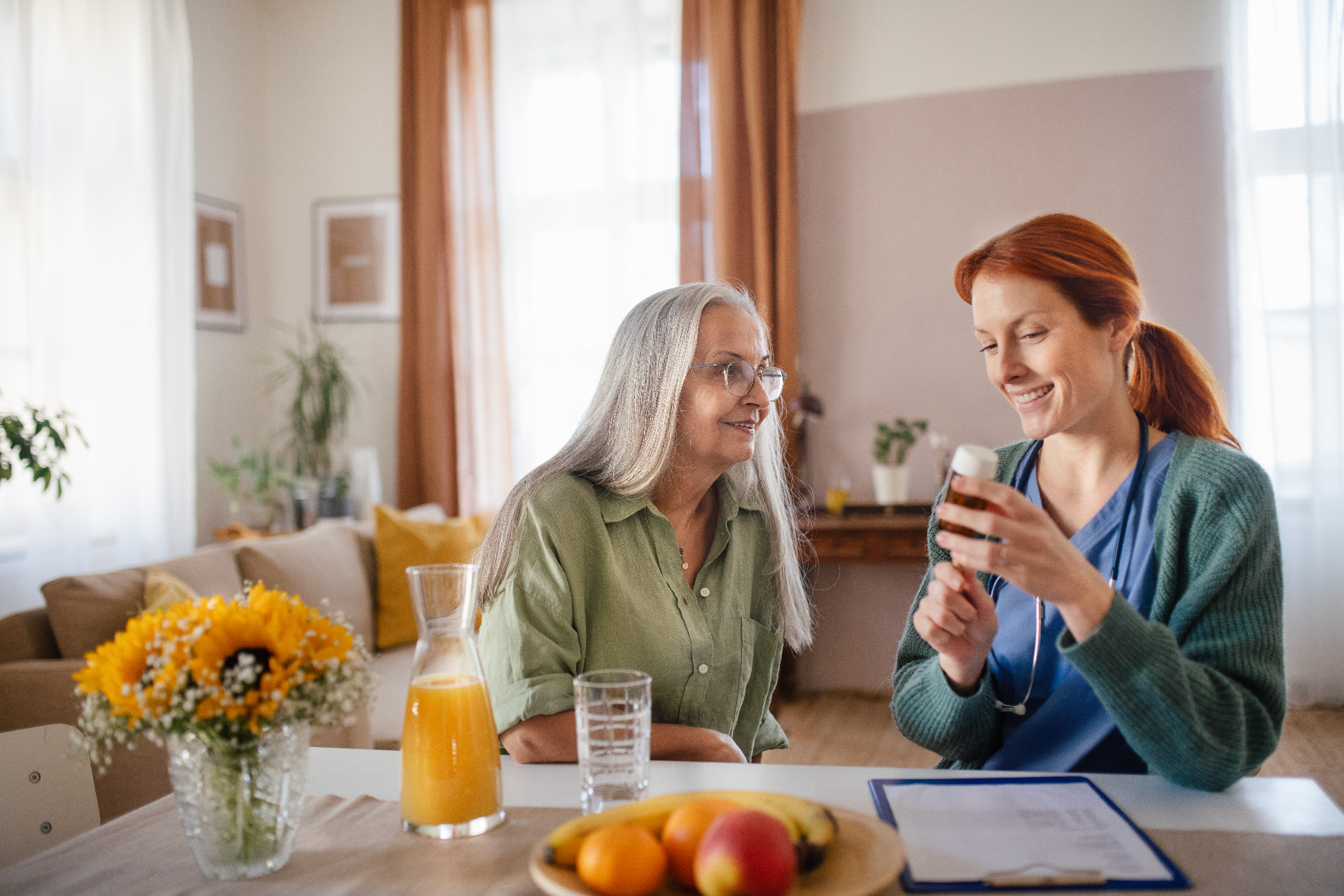 A caregiver helping an elderly person with gentle care
